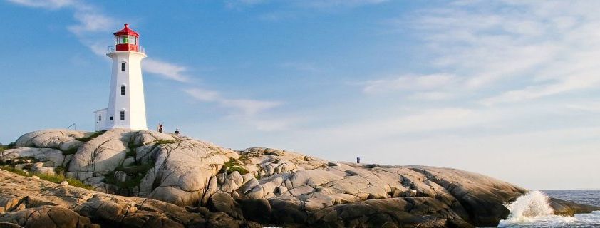 Lighthouse on a rock, right by the sea 